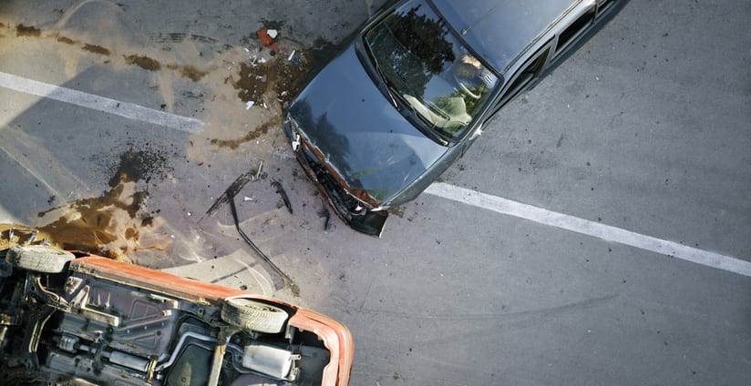 Broken car after a traffic accident in the parking lot of a repair station.  Car body